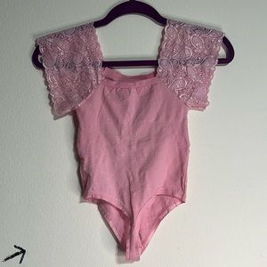 Pink body suit